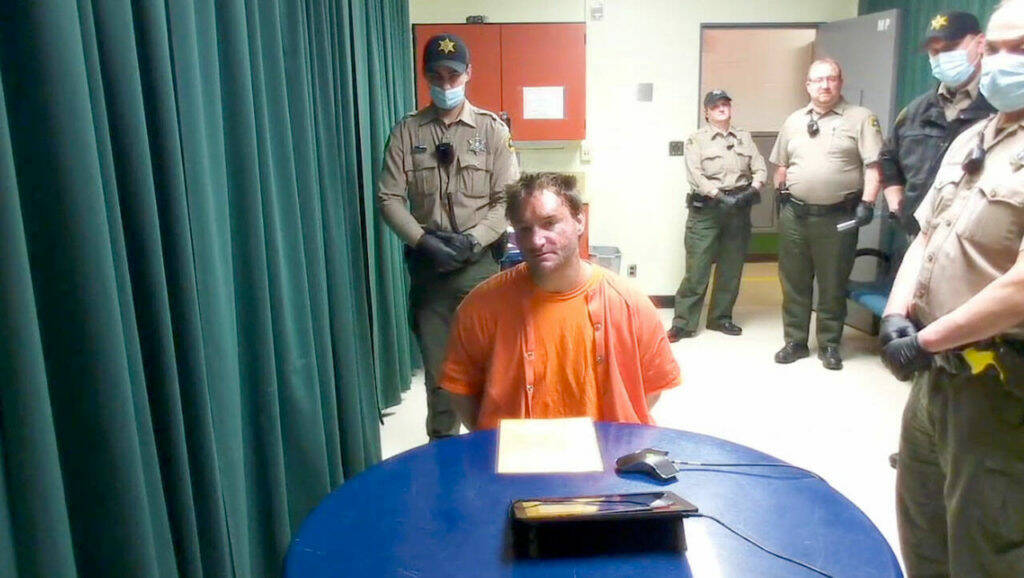 Bret Kenney appears in court via video in May 2022 after being accused of killing his mother, Teri Ward of Sequim, and attempting to kill Sequim police officer Daniel Martinez during a traffic stop in 2022.
