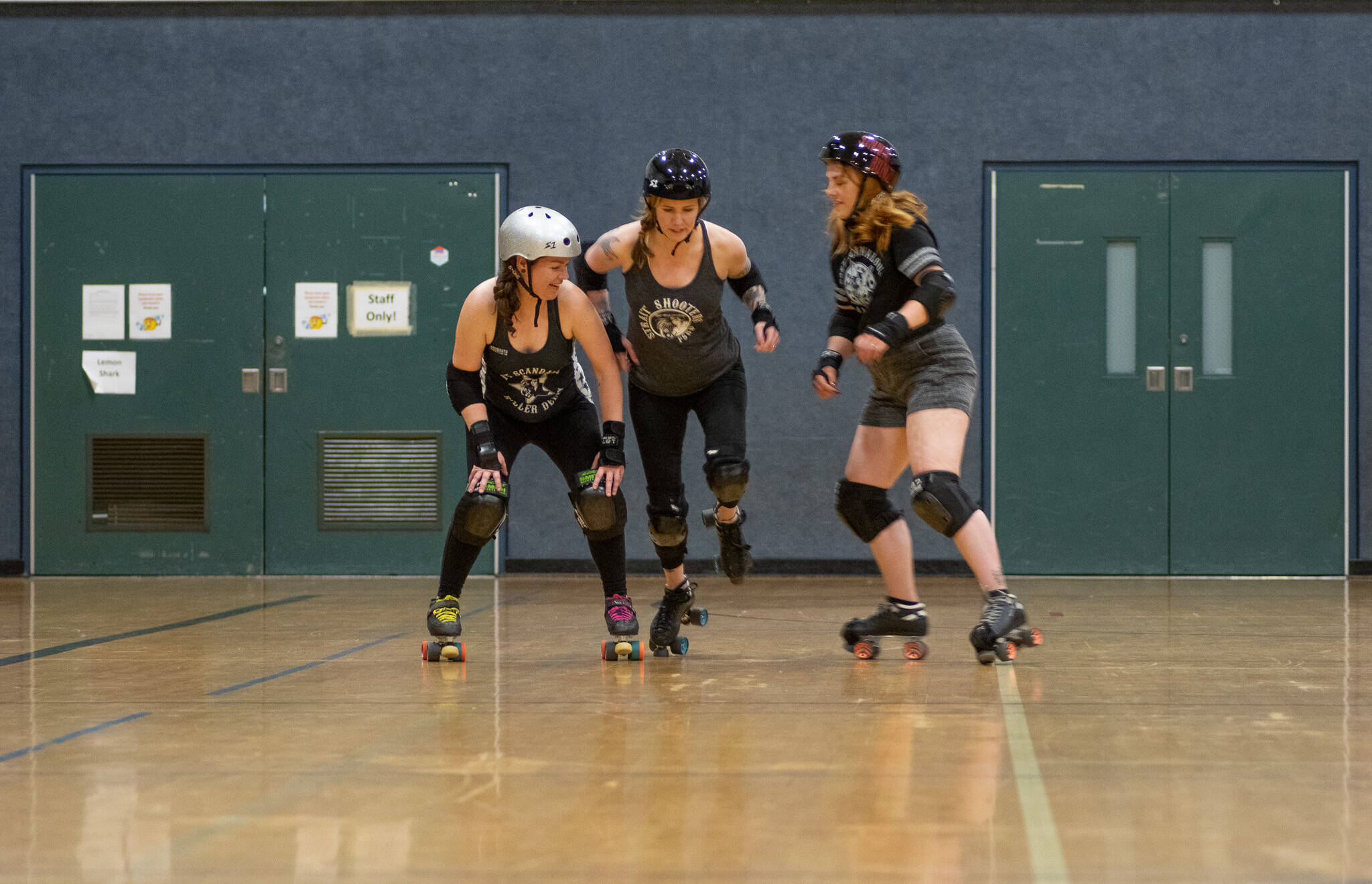 Emily Matthiessen / Olympic Peninsula News Group
From left, Amber Ahrens, Shauna Rogers McClain and Brittney Vincent practice blocker and jammer moves at a recent roller derby practice.