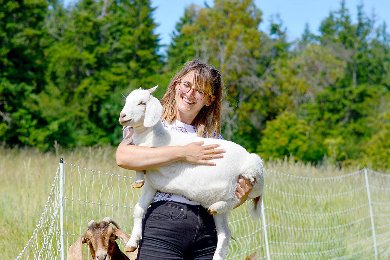 Lydia Vadopalas, holding Abilene, will give free, farm-inspired art demonstrations at the Port Townsend Farmers Market this Saturday. photo courtesy of Northwind Art