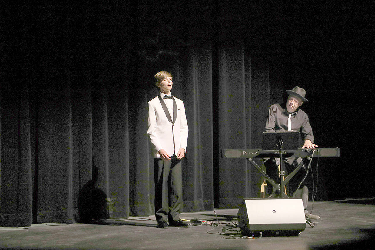 Everett Polansk, 14, provides the first performance at the Field Hall Theater. (Lexie Winters)