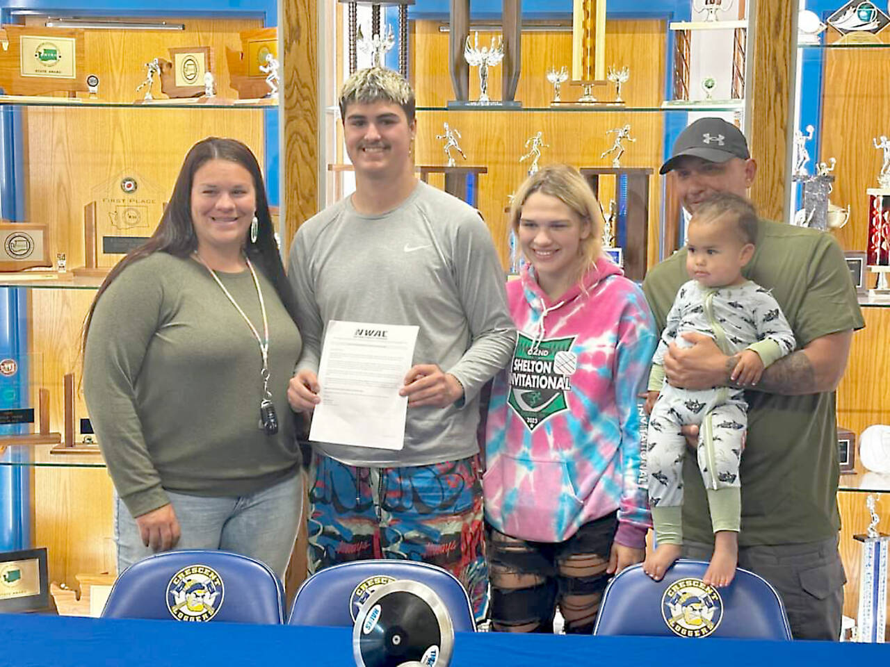 From left, mother Alicia Ferro-May, Conner Ferro-May, sister Chloe Ferro-May and stepfather Rich Albaugh celebrate Crescent senior Conner Ferro-May signing a letter of intent to participate in track and field at Mount Hood Community College in Gresham, Ore. (Crescent High School)
