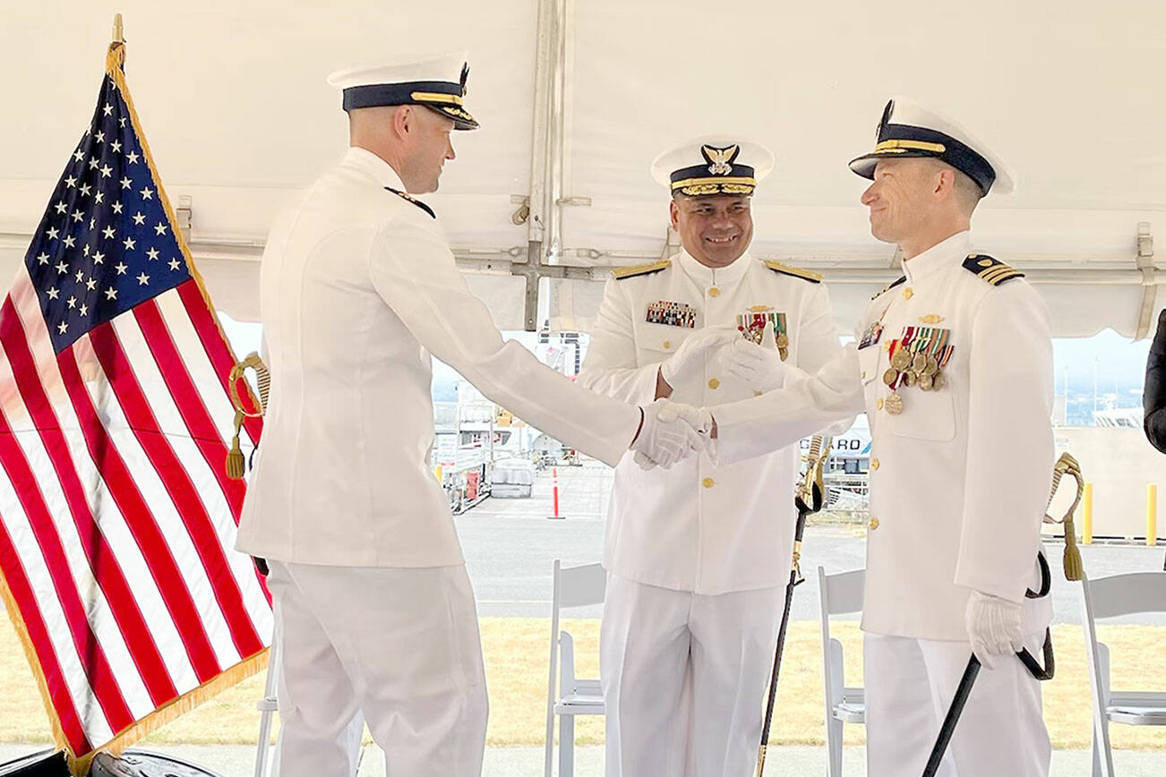 Cmdr. Adam Disque, left, is the Coast Guard cutter Active’s 30th commanding officer. He relieved Cmdr. Brian Tesson, right. Vice Adm. Andrew Tiongson, commander Coast Guard Pacific Area, center, presided over last week’s ceremony.