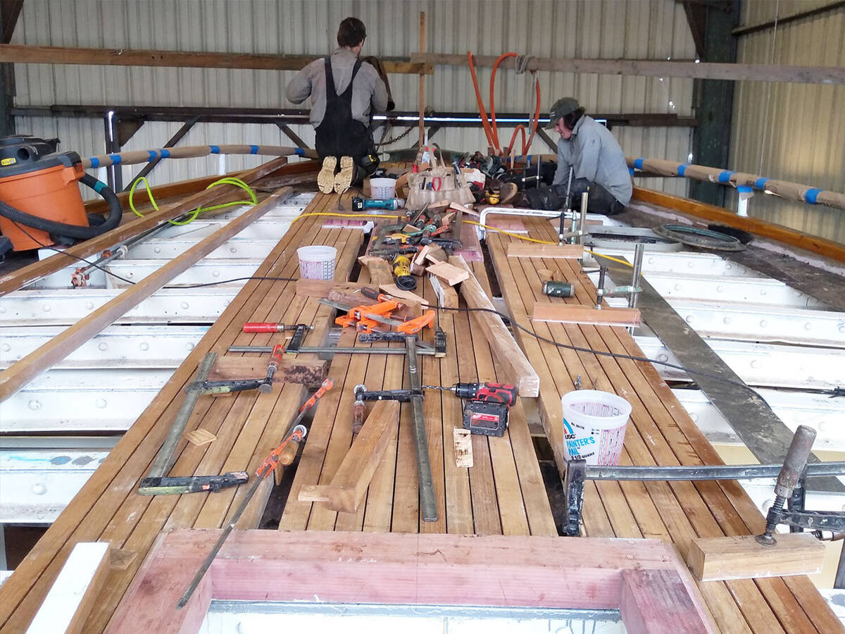 Haven Boatworks crew works on finishing a deck. Photo courtesy First Fed