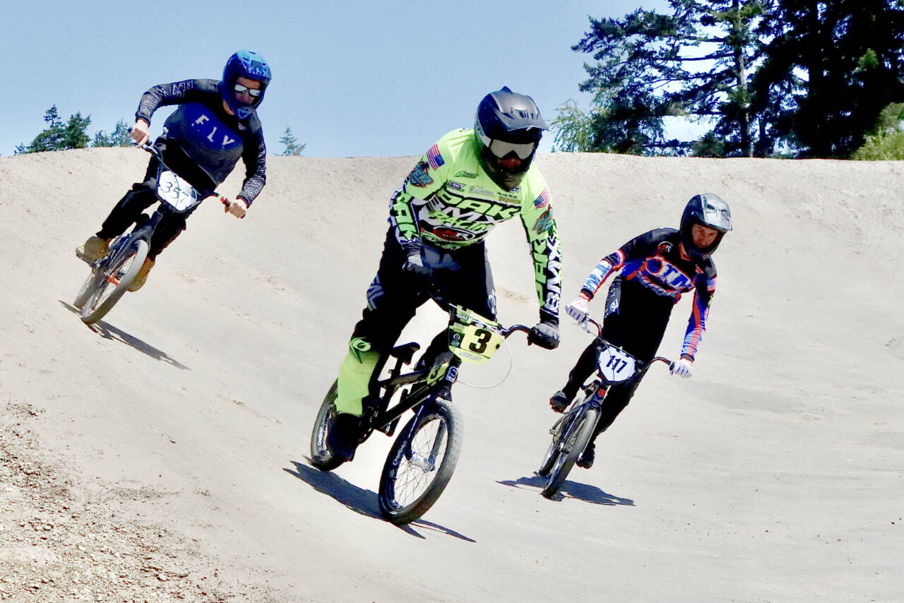 From left, Sean Tamburro of Port Angeles, Ben Mriglot of Shelton and Jeremy Kerr of Orting race in Sunday's state qualifier at the Lincoln Park BMX track. (Dave Logan/for Peninsula Daily News)