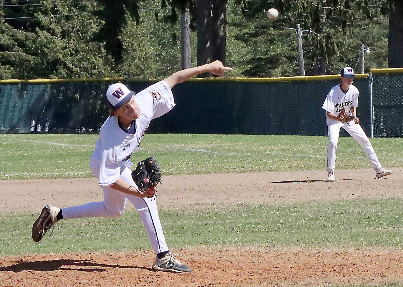 Wilder AA's Hunter Stratford pitches against Wilder A in a game Sunday afternoon at Volunteer Park. In the background is Wilder AA first baseman Rylan Politika. (Dave Logan/for Peninsula Daily News)