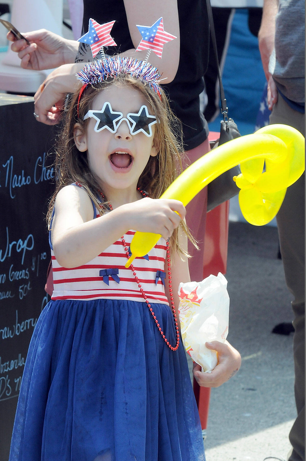 Riley Lohman, 5, of Port Angeles celebrates Independence Day at The Gateway in downtown Port Angeles on Tuesday. (Keith Thorpe/Peninsula Daily News)
