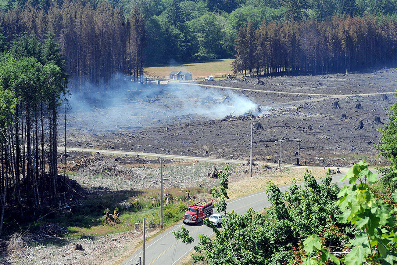 A burnt area is seen from a logging road near Valley View residential housing along Bogachiel Way west of Forks. The fire started Tuesday afternoon. Its cause was unknown. (Lonnie Archibald/for Peninsula Daily News)