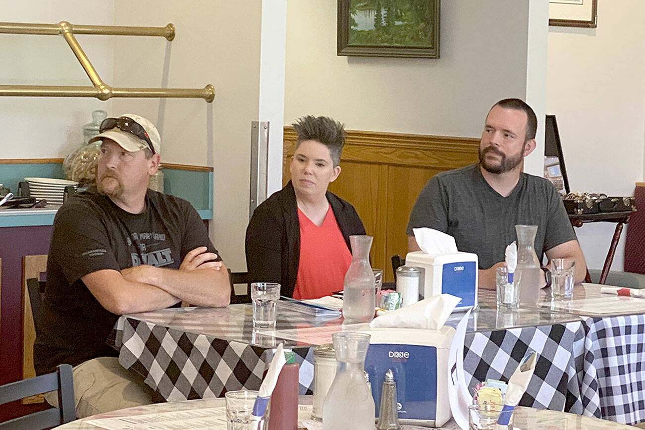 Speaking at a candidate forum on Thursday were, from left, Mark Karjalainen, Navarra Carr and Nick Merrigan. (Ken Park/Peninsula Daily News)