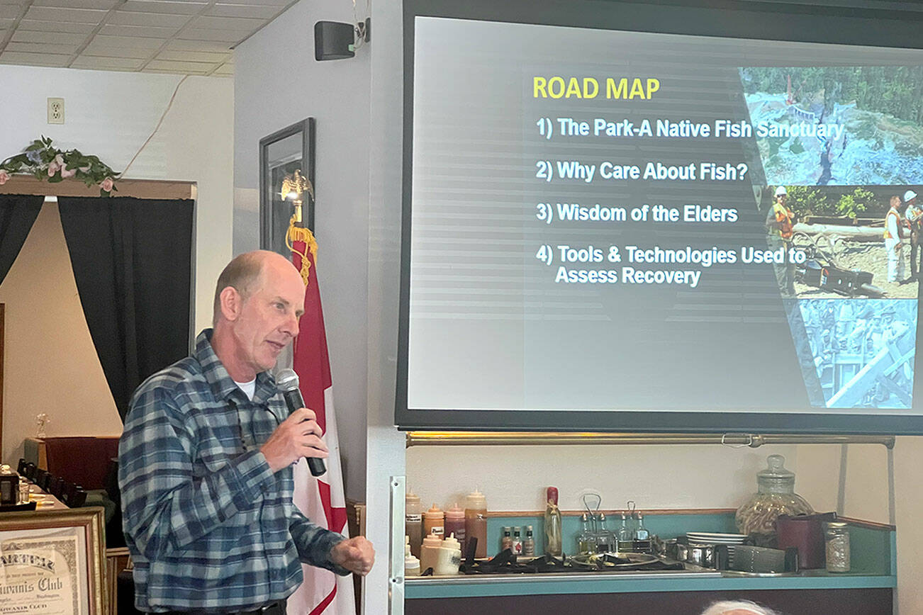 Sam Brenkman, chief fisheries biologist for Olympic National Park, speaks about fish restoration on the Elwha River following the removal of two dams during a meeting of the Kiwanis Club of Port Angeles at Joshua’s Restaurant on Thursday. (Peter Segall/Peninsula Daily News)