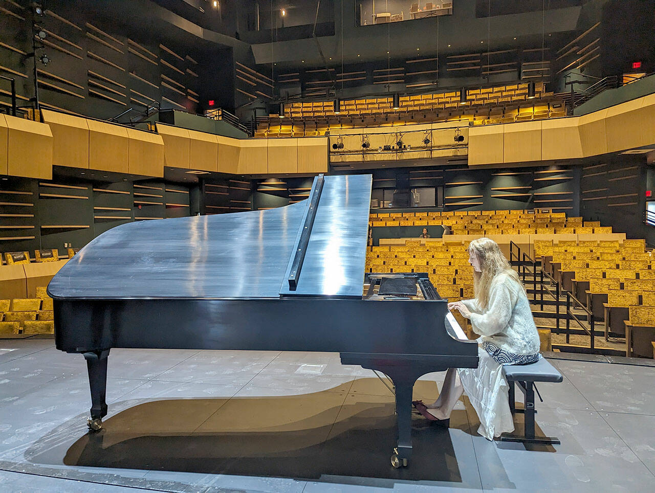 Katya Grineva performs a sound check in the Donna M. Morris Theater on Friday afternoon in preparation for a concert on Sunday. (Steve Raider-Ginsburg/Field Hall executive director)