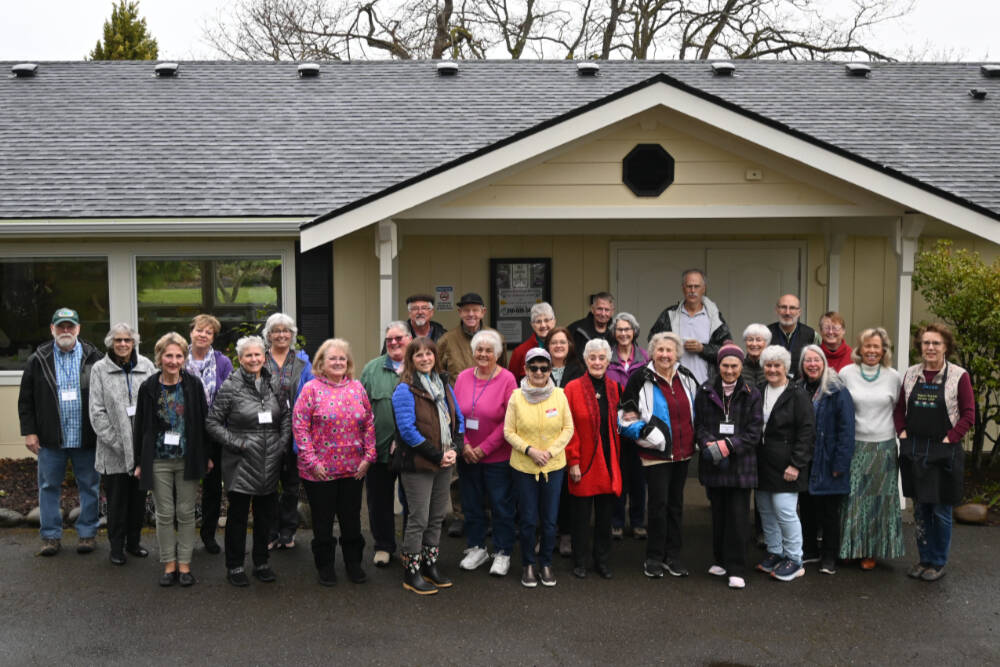 Members of the Sequim Prairie Garden Club (SPGC) gather outside the recently renovated clubhouse at Pioneer Memorial Park. Club members say they are excited to celebrate SPGC’s 75th year with a community party set for Saturday. (Michael Dashiell/Olympic Peninsula News Group)