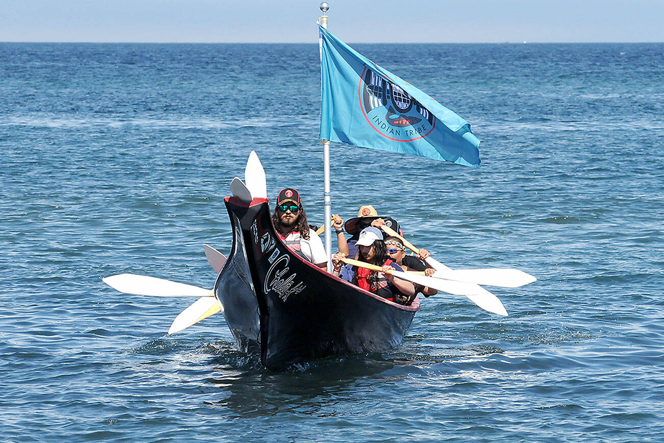 A canoe representing the Hoh Tribe approaches the beach on Lower Elwha Klallam territory on Sunday. Canoe teams will set out Tuesday for their next stop at Jamestown Beach near Sequim for an overnight stay hosted by the Jamestown S’Klallam Tribe. Pullers arriving in Port Townsend on Wednesday will greeted by representatives of the Lower Elwha, Jamestown and Port Gamble S’Klallam tribes. (Keith Thorpe/Peninsula Daily News)