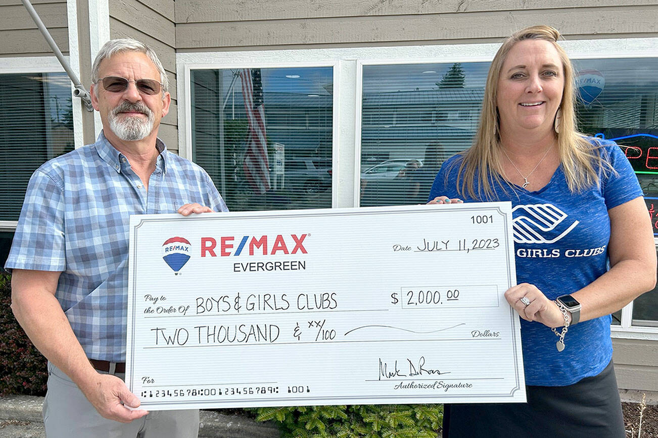 Pictured are Mark DeRousie, of RE/MAX, and Janet Gray, of the Boys & Girls Clubs.