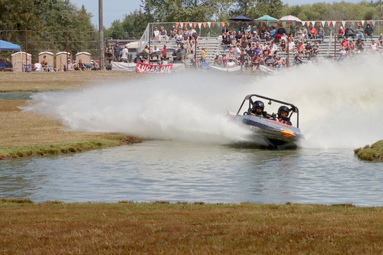 The Psycho Racing No. 151 boat with Kyle Patrick of Albany, Ore., driving races in the unlimited class at the American Sprint Boat Racing at the Extreme Sports Park outside of Port Angeles. A total of 38 teams from the U.S. and New Zealand competed in unlimited, modified and 400 classes in racing that was expanded to two days this summer. For final results, go online at www.peninsuladailynews.com or look in Tuesday's sports section. The sprint boats will return to the ESP on Sept. 9-11. (Dave Logan/for Peninsula Daily News)