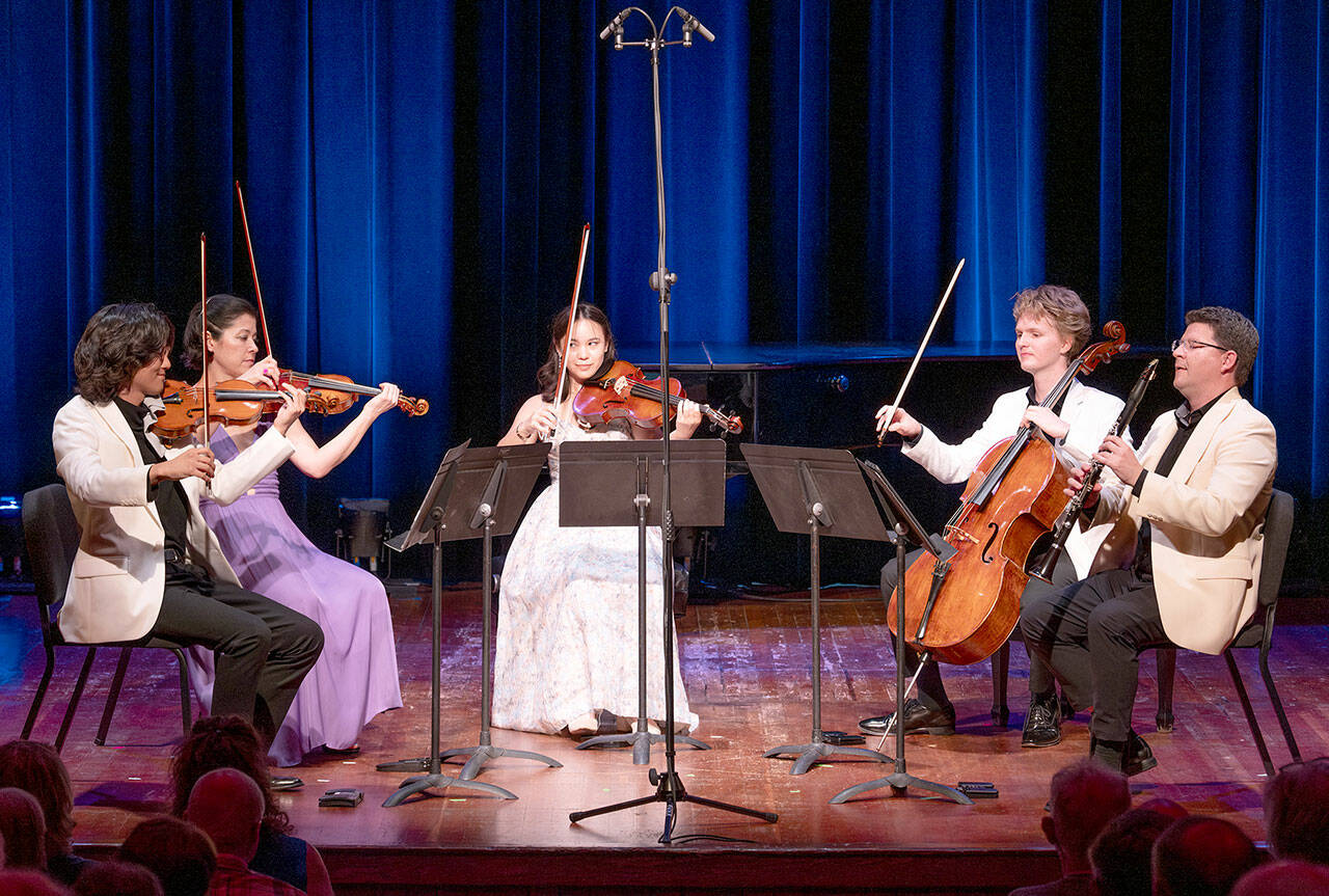 Left to right, violinist Jason Moon, violinist Clara Neubauer, violist Laura Liu, cellist Carlo Lay and clarinetist Alexander Fiterstein. (David Conklin)
