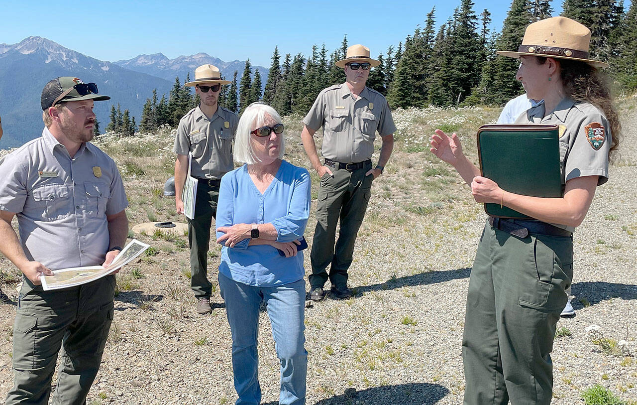 Sen. Patty Murray, center, listens to Olympic National Park Superintendent Sula Jacobs, right, explain the ongoing investigation into the cause of the fire that destroyed the Hurricane Ridge Day Lodge on May 7 and the park’s efforts to maintain visitor access this summer and possibly into the winter. (Paula Hunt/Peninsula Daily News)
