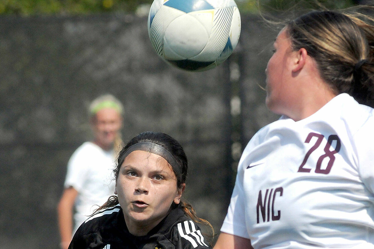 KEITH THORPE/PENINSULA DAILY NEWS
Peninsula's Taya Bpohenko, left, looks for control as North Idaho's Cora Anderson looks back during Saturday's friendly at Wally Sigmar Field in Port Angele.