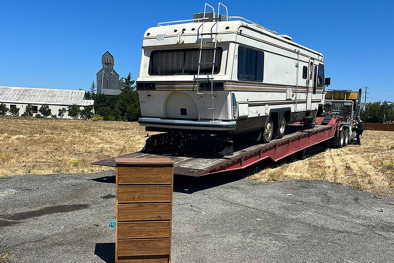 In mid-July, an RV parked partially on public and private property was towed at the request of the City of Sequim after it was deemed abandoned after 18 months parked in one spot. It’s one of a handful of RVs and vehicles illegally parked in the City of Sequim as nonprofit agencies seek safe housing options for residents. (Michelle Ridgway)
