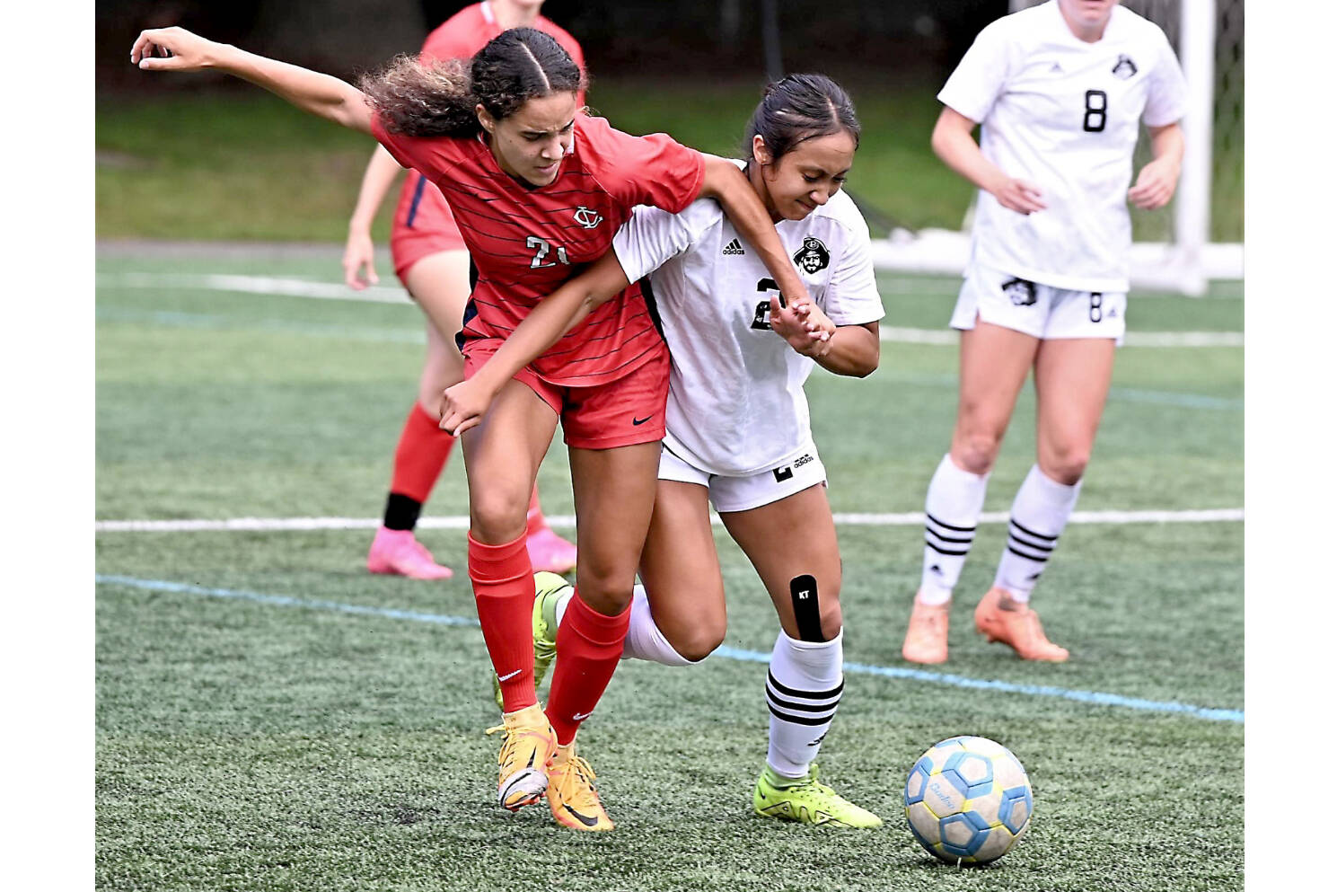 Peninsula College's Briana-Jean Tanaka (2) battles with Lower Columbia's Nataija Blaylock (21) for the ball in an NWAC Friendly held Tuesday in Tukwila. In the background is Peninsula College's Anna Petty. Tanaka and Petty each scored two goals as Peninsula won 8-1. (Rick Ross/Peninsula College)