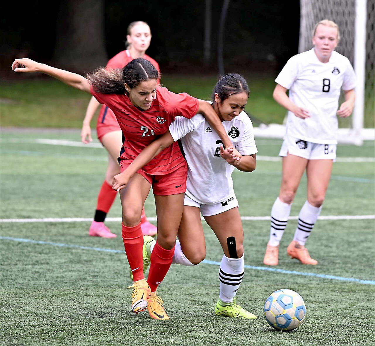 Peninsula College’s Briana-Jean Tanaka (2) battles with Lower Columbia’s Nataija Blaylock (21) for the ball in an NWAC Friendly held Tuesday in Tukwila. In the background is Peninsula College’s Anna Petty. Tanaka and Petty each scored two goals as Peninsula won 8-1. (Rick Ross/Peninsula College)