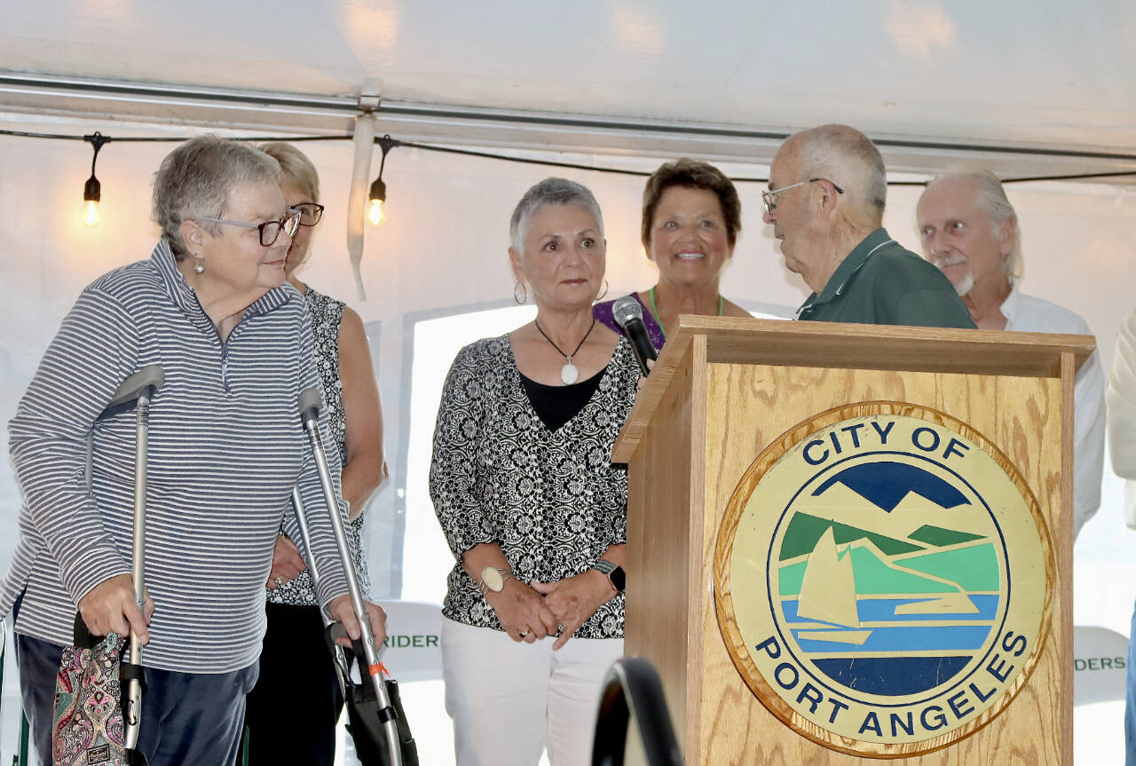 Scooter Chapman interviews members of the 1964 Port Angeles girls badminton team that was honored at Saturday’s Civic Field event, including Hall of Famer Hester Hill, left. (Dave Logan/for Peninsula Daily News)