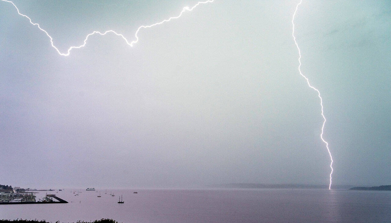 Lightning streaks across Port Townsend Bay on Tuesday afternoon. (Steve Mullensky/for Peninsula Daily News)