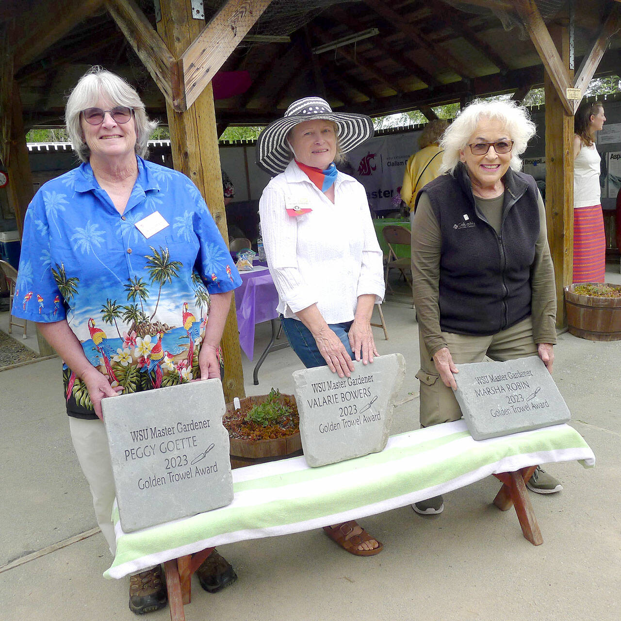 Master gardeners, left to right, Peggy Goette, Valarie Bowers and Marsha Robin received Golden Trowel awards.