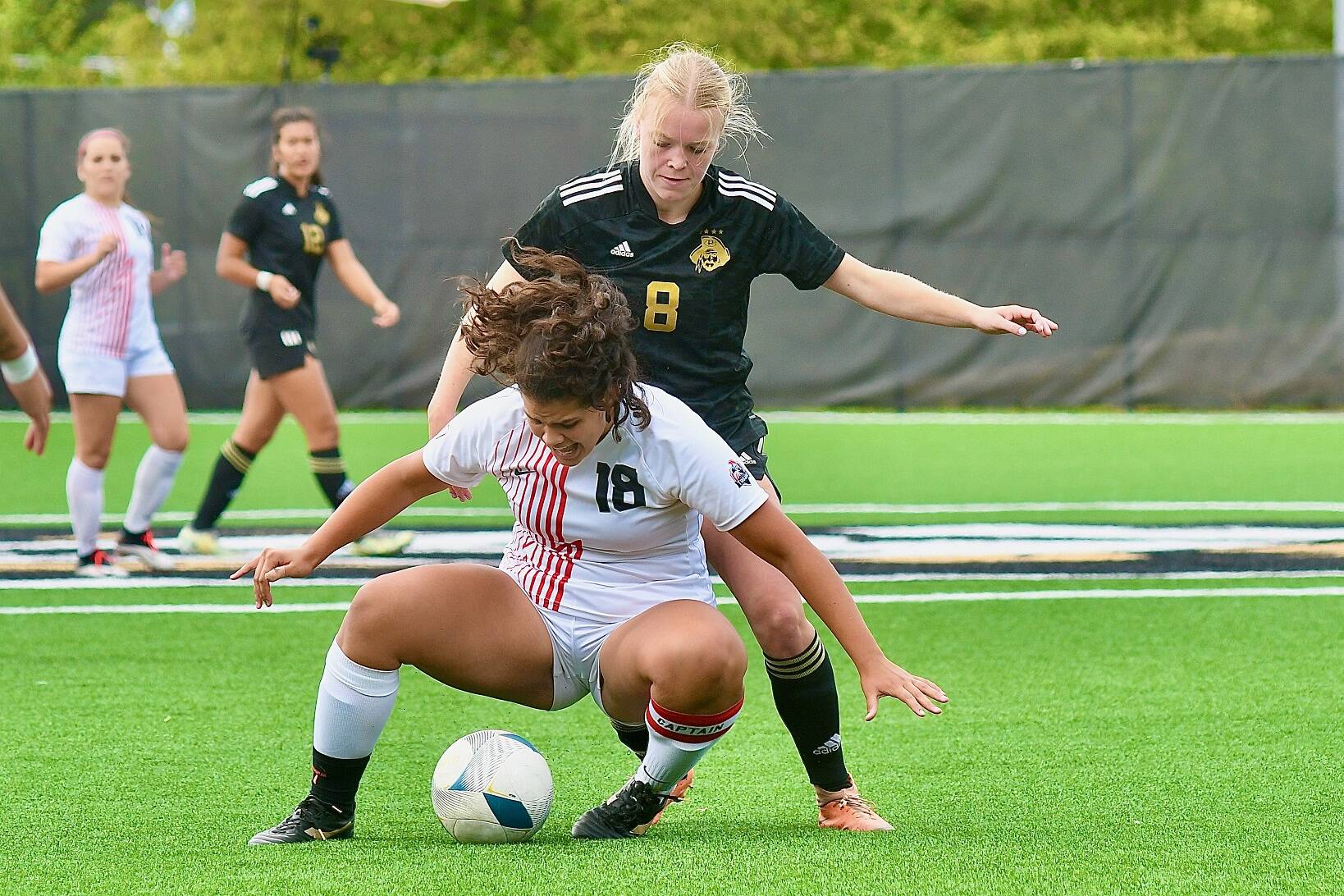 Peninsula College’s Anna Petty (8) battles with Everett’s Miah Manibusan (18) over possession of the ball in Wednesday’s match at Wally Sigmar Field. Petty had two goals and an assist in an 11-0 Peninsula victory. (Jay Cline/Peninsula College)