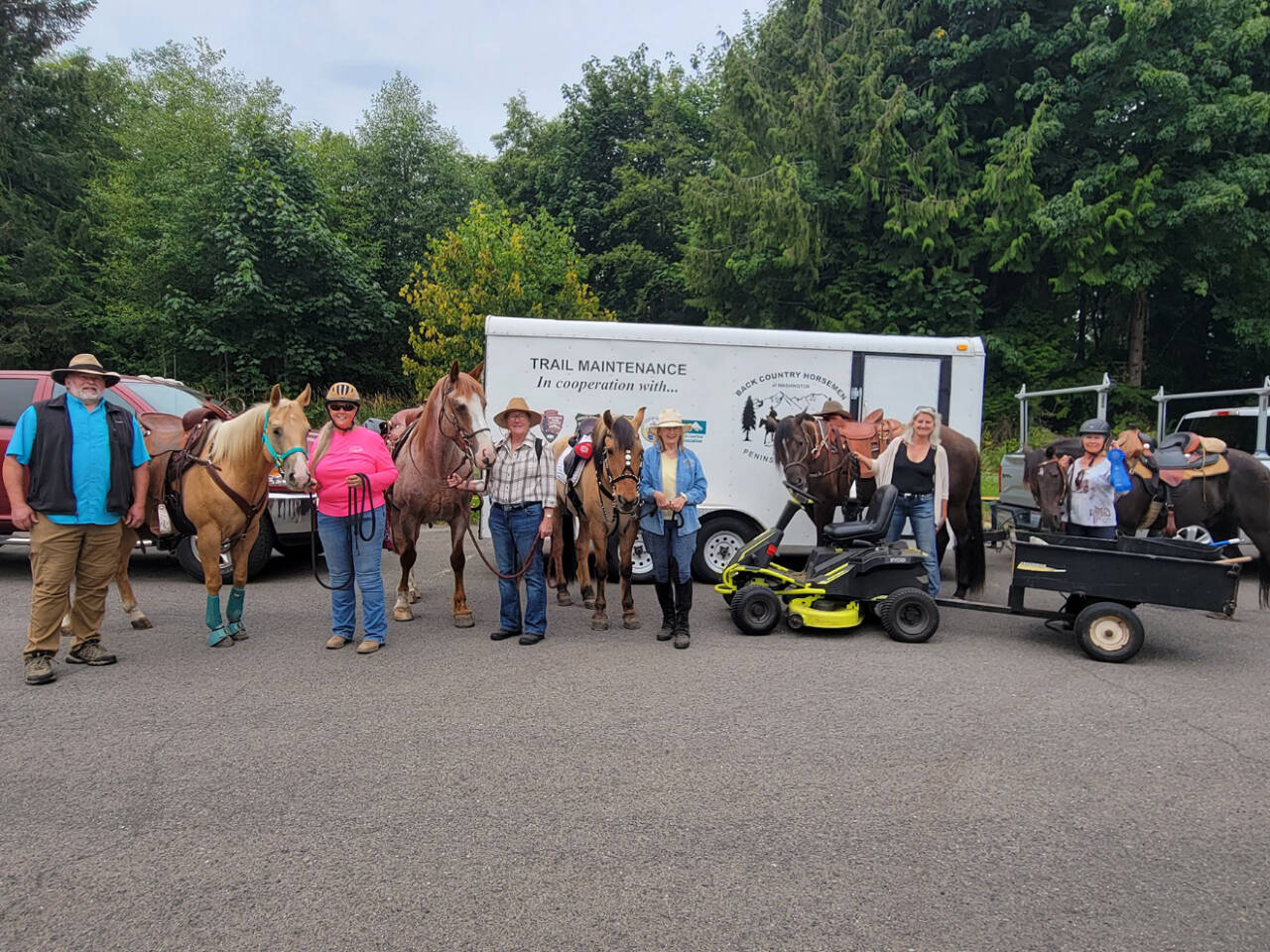 At the Joyce Daze Parade, participating Back Country Horsemen Peninsula Chapter members were awarded a Blue Ribbon for the best Animal Entry in the parade. (PHOTO BY LINDA MORIN)