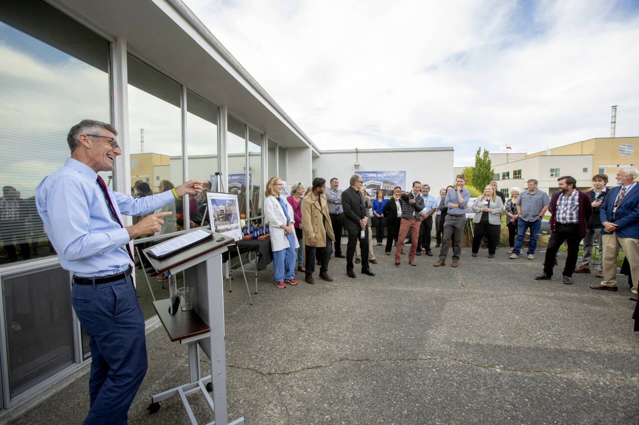 Jefferson Healthcare CEO Mike Glenn jokes with Port Townsend City Manager John Munro and Mayor David Faber, center, on Thursday at a groundbreaking for a $84 million project. (Steve Mullensky/for Peninsula Daily News)