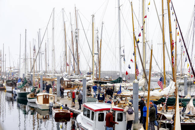 Steve Mullensky/for Peninsula Daily News
The south dock at the Point Hudson Marina is a hub of activity on Friday, the first day of the Wooden Boat Festival. Hundreds of wooden boats of all sizes and shapes are available for viewing during the three-day show.