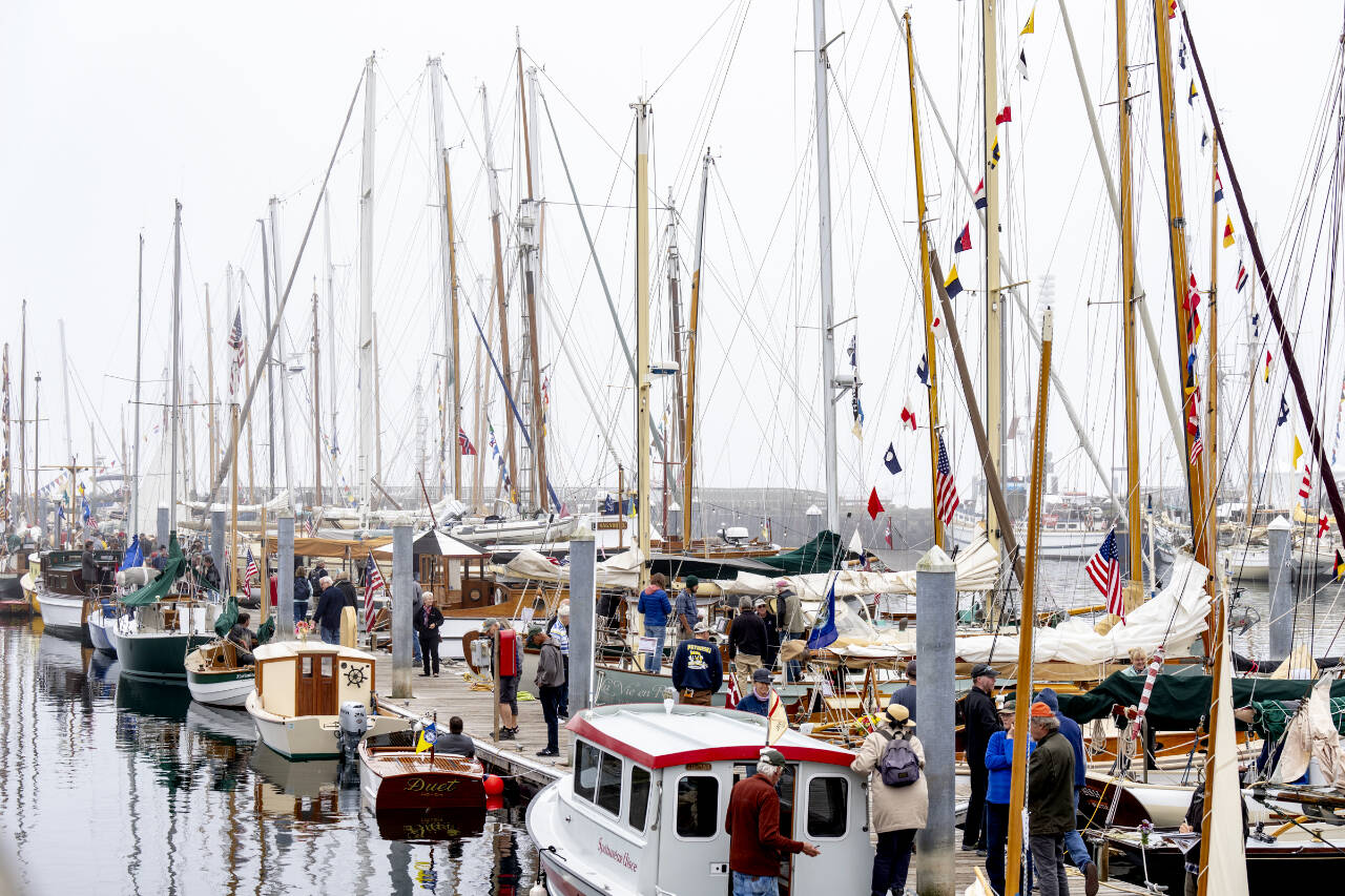 The south dock at the Point Hudson Marina is a hub of activity on Friday, the first day of the Wooden Boat Festival. Hundreds of wooden boats of all sizes and shapes are available for viewing during the three-day show. (Steve Mullensky/for Peninsula Daily News)