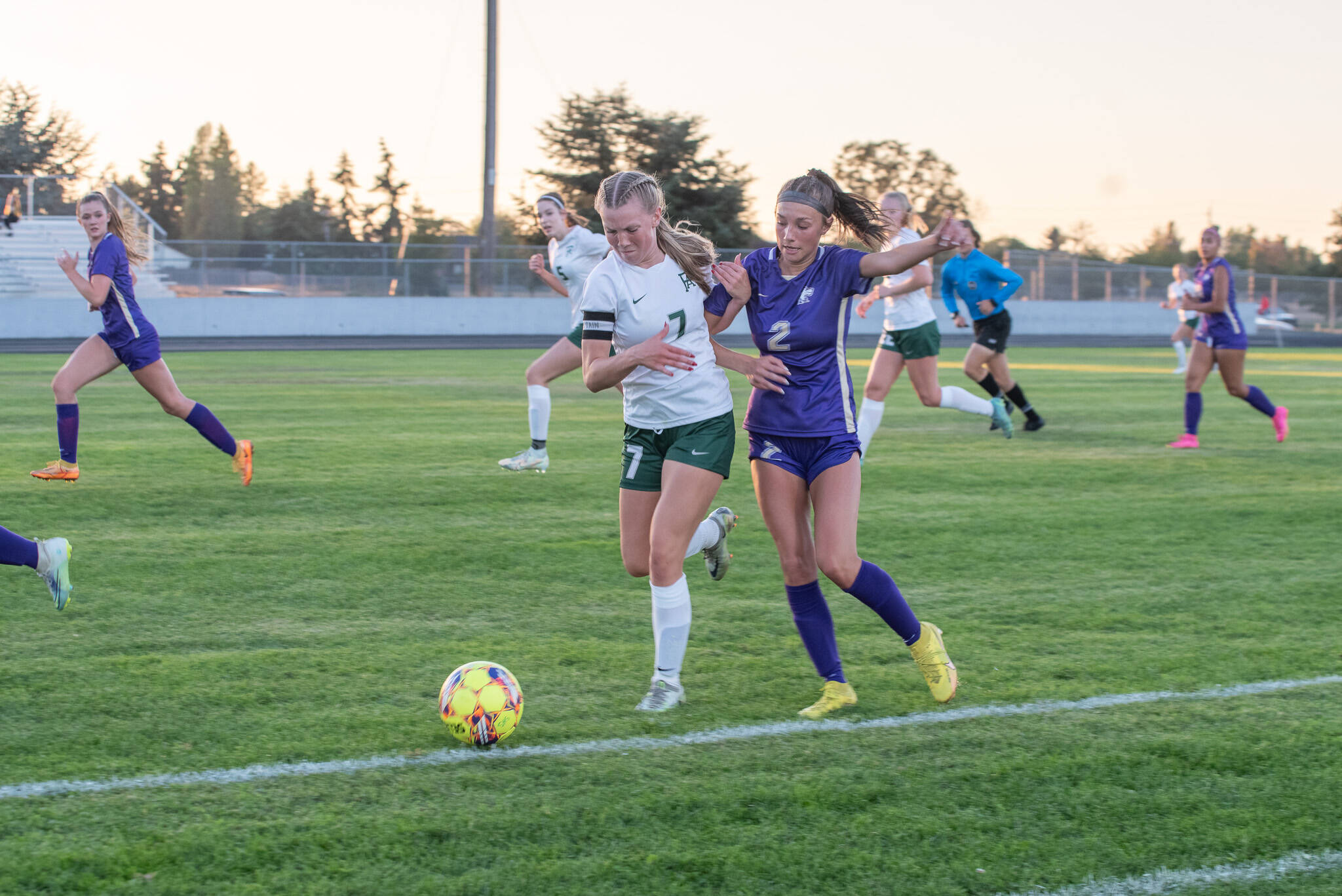 Emily Matthiessen (2)/Olympic Peninsula News Group
Port Angeles’ Izzy Felton, left, and Sequim’s Mikiah Winter jostle for possession of the ball along the sideline during the first half of the Wolves 2-1 Rainshadow Rumble girls soccer victory.
