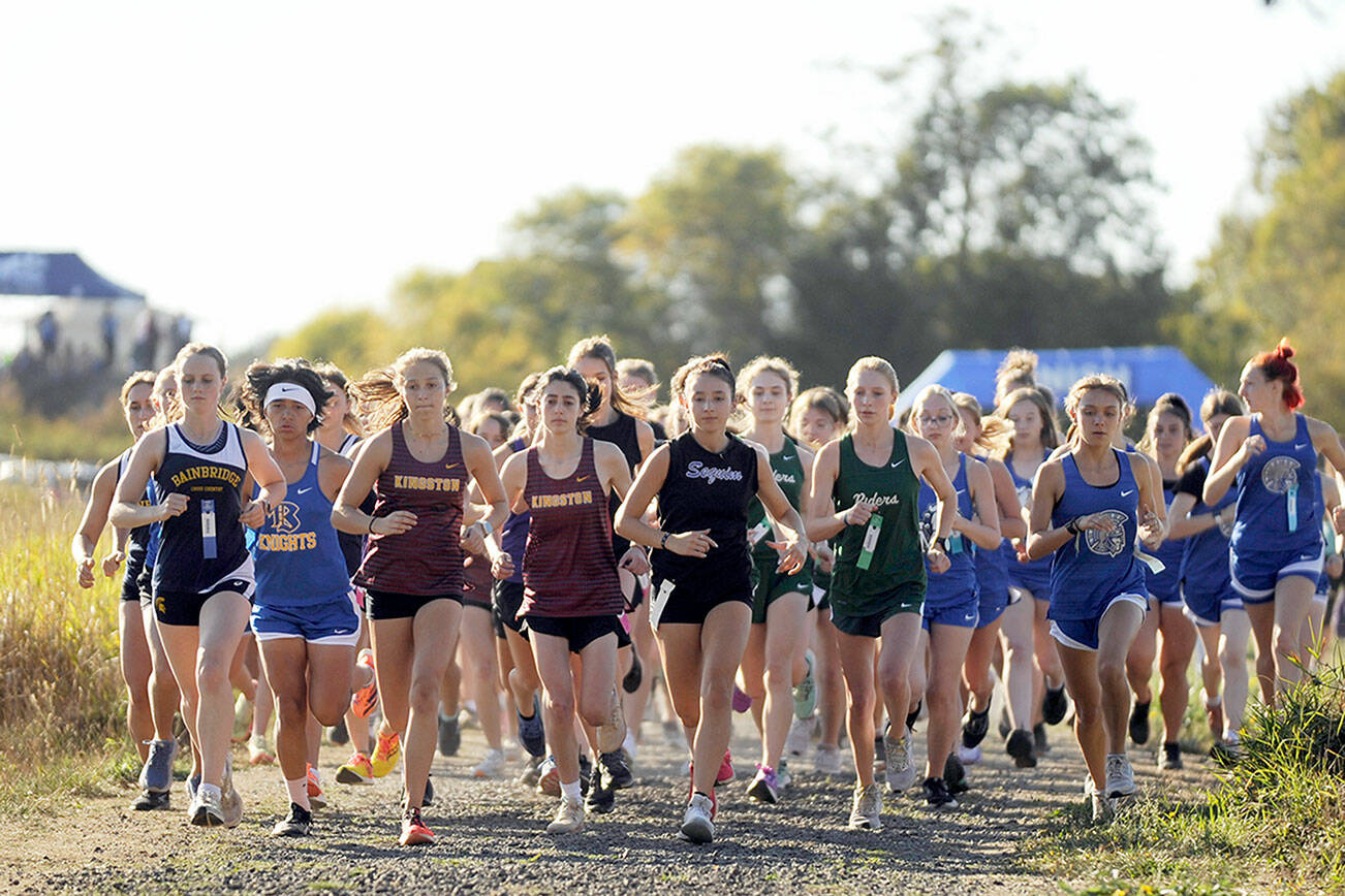 Michael Dashiell/Olympic Peninsula News Group
Runners, including Sequim's Kaitlyn Bloomenrader, center, and Port Angeles' Leia Larson,  begin the 3.1-mile Olympic League girls cross country meet at Dungeness Recreation Area on Wednesday.