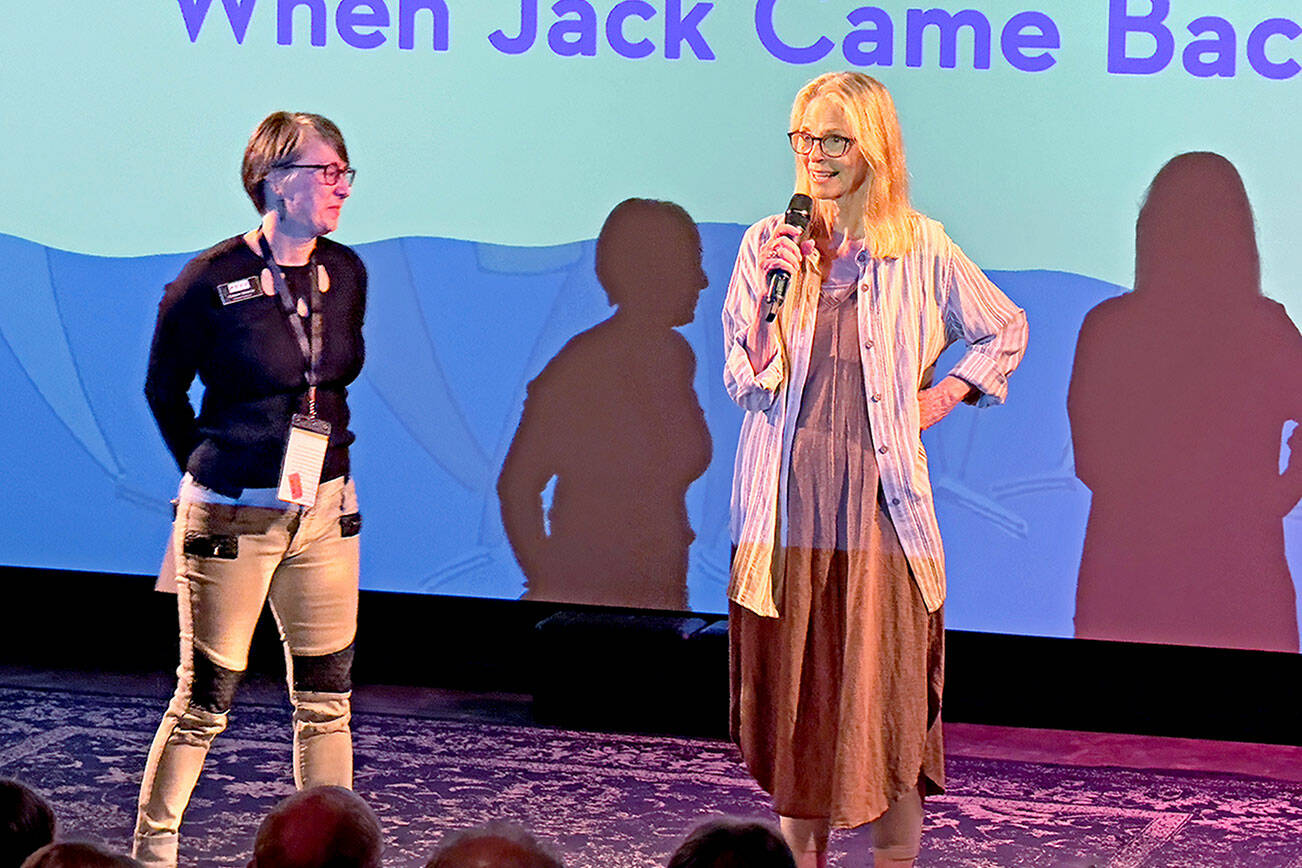 Actress Lindsey Wagner, right, with Port Townsend Film Festival Program Director Christy Spencer, stands on stage at Key City Public Theater in Port Townsend on Saturday to introduce the film, “When Jack Came Back,” one of the entrants in the 2023 film festival that stars Wagner as a mother in the grip of Alzheimer’s Disease. (Steve Mullensky/for Peninsula Daily News)