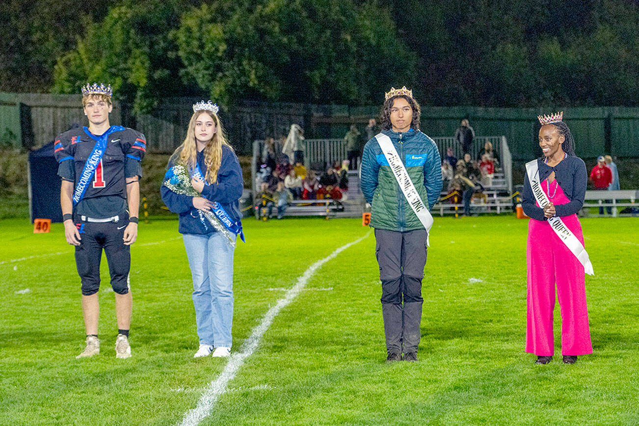 Homecoming Royalty are, from left, Chimacum High School King Gary Zambor and Queen Julia Breitweg, and Port Townsend High School King Ken Llotse-Rowell and Queen Tadu Dollarhide as they were introduced to the spectators at Memorial Field in Port Townsend on Friday. (Steve Mullensky/for Peninsula Daily News)