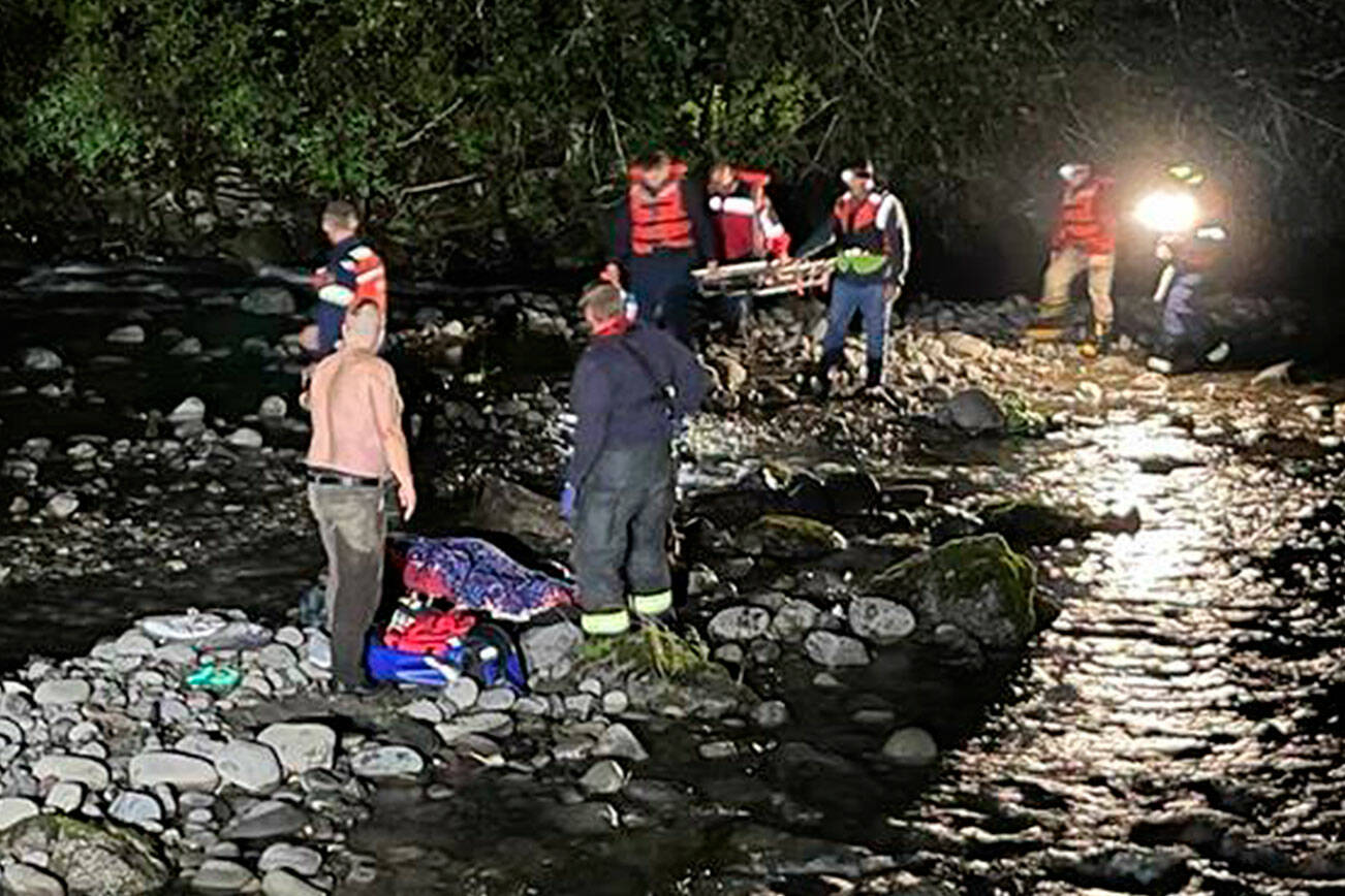 Clallam County Fire District 3 conducts a rescue on Thursday for an injured teenager in the Dungeness River. (Chris Turner)
