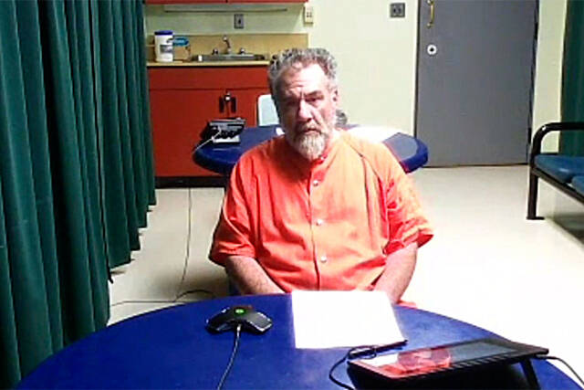 John Fitzgerald Barcellos, 59, of Sequim appears in Clallam County Superior Court on Sept. 29 where he was charged with 10 felonies. (Photo screen capture)