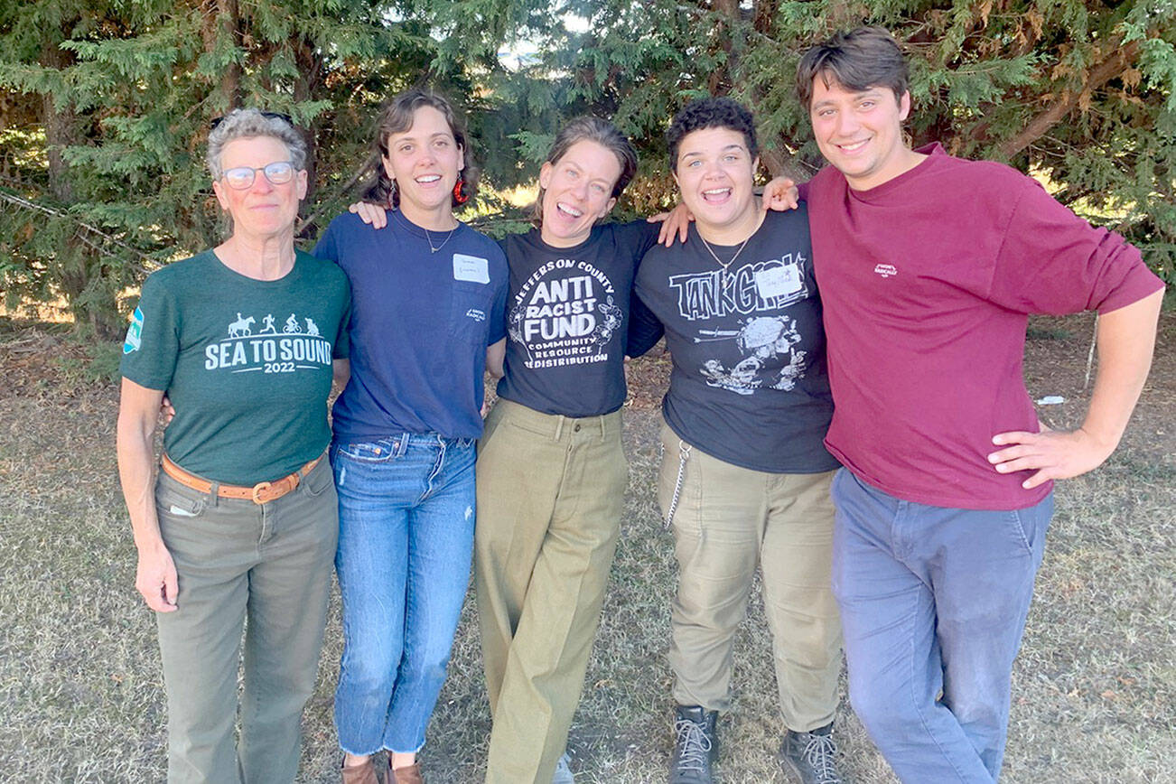 Pictured, from left to right, are SisterLand Farms volunteers Emily Marcus, Sammi Grieger, and Farmers Jenson, Eli Smith and Benji Astrachan at the North Olympic Land Trust Harvest Dinner. SisterLand Farms, located in Port Angeles, was named Farmer of the Year by NOLT for their work in the community. (Courtesy photo / Katrina Shelby, SisterLand Farms)