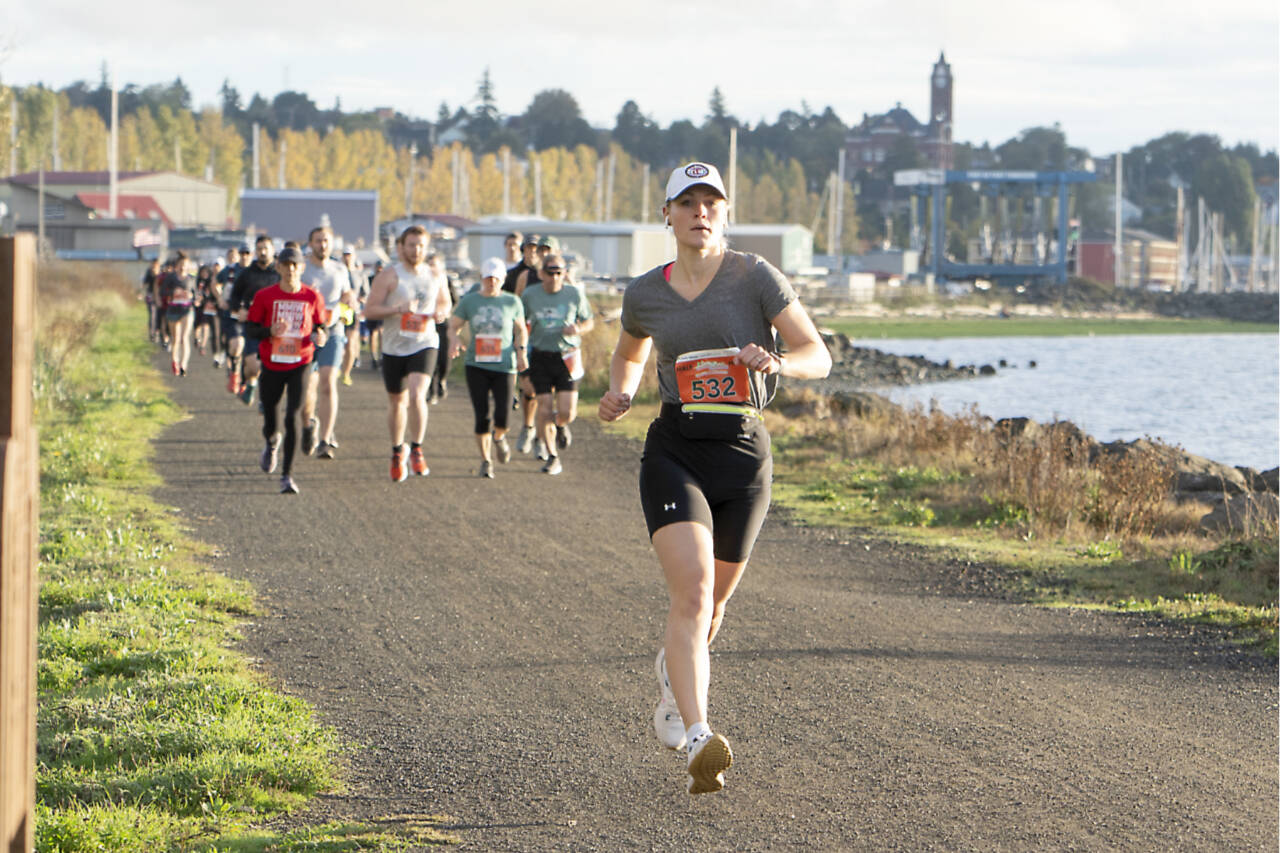 Margaret Shull, 27, of Puyallup leads the female runners at the start of the Run the Peninsula's Larry Scott Trail Run half-marathon Saturday in Port Townsend. Shull went on to win the women's half marathon with a time of 1:38:31.72. (Steve Mullensky/for Peninsula Daily News)