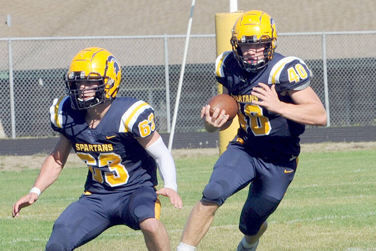 Forks’ Walker Wheeler, left, and Nate Dahlgren, right, made the first team of the Central 2B North Division as defensive players. They also made the second team as offensive players. (Lonnie Archibald/for Peninsula Daily News)