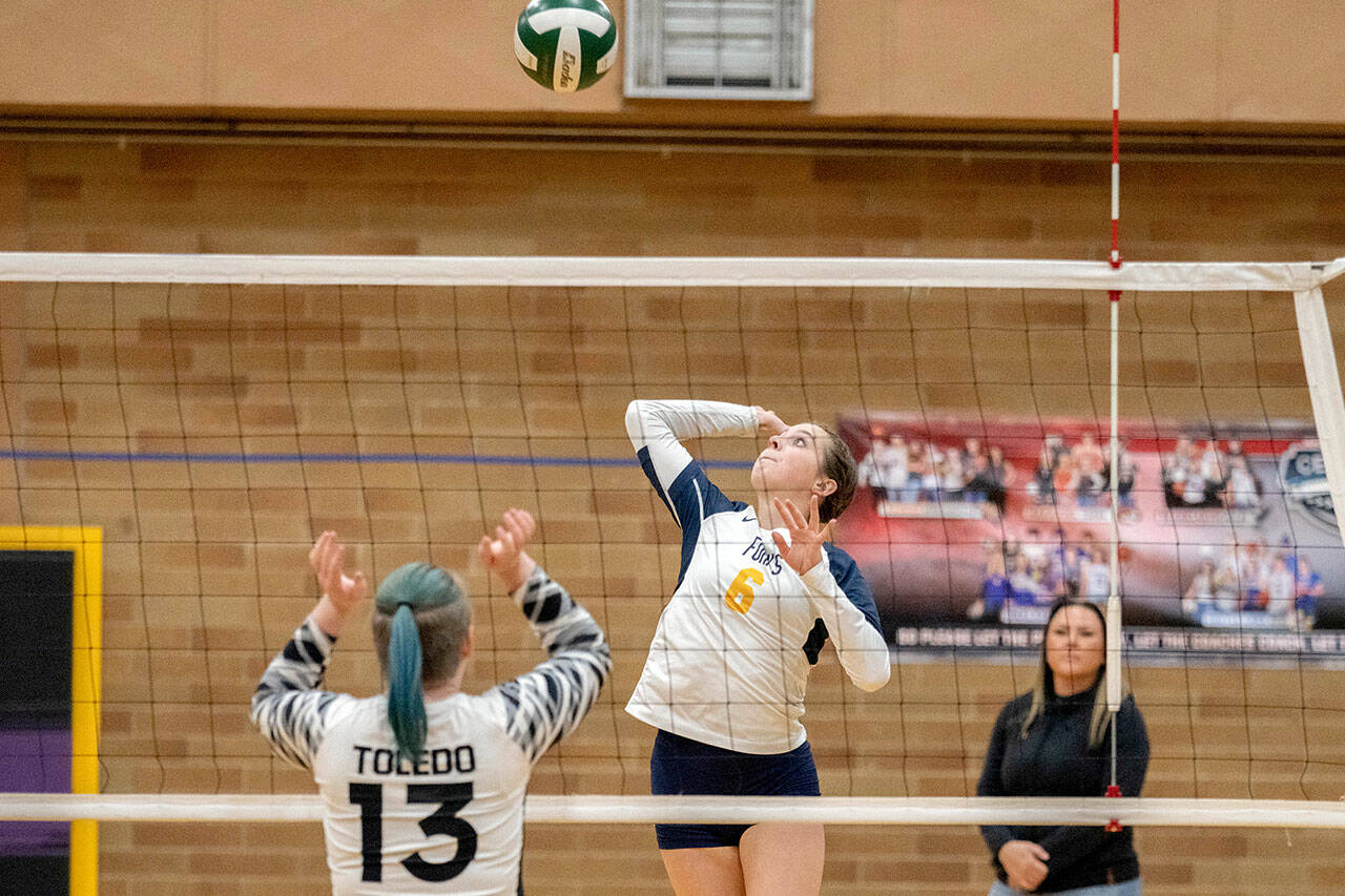 Forks’ Chloe Gaydeski eyes the ball as she prepares to send a spike over the net during the Spartans’ 3-1 win over Toledo on Wednesday during the Class 2B District 4 Tournament. (Josh Kirshenbaum/The Chronicle)