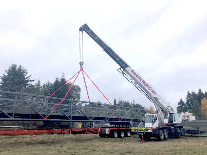 A bridge section is unloaded at a Clallam County gravel pit facility. (Clallam County Public Works)