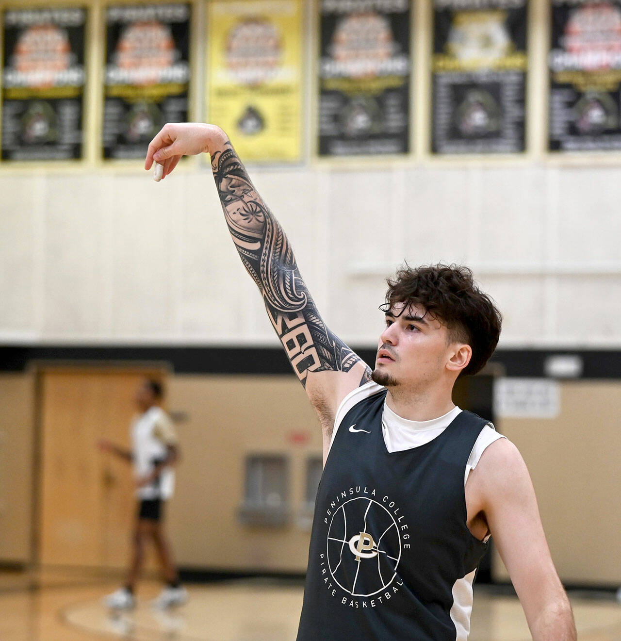 Peninsula sophomore Aiden Olmstead follows through on a jump shot during a recent practice. Olmstead saw action as a freshman with the Pirates before an injury cut his 2022-23 season short.