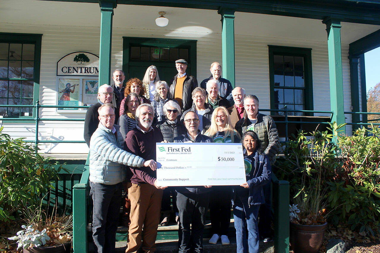 First Fed presents a charitable donation to the board and staff at Centrum in honor of the arts non-profit’s 50th anniversary in Port Townsend. Pictured, front row, left to right, are Centrum Executive Director Robert Birman, Centrum Board Chair Scott Wilson, First Fed Board Member Norm Tonina, First Fed Port Townsend Branch Manager Luxmi Love; second row, left to right: Walter Parsons, Katy Goodman, Catharine Robinson, Sara Spalding, John Murock; third row, left to right: Kris Easterday, Renee Klein, Leah Mitchell, Robert Alexander, Sam Shoen; fourth row, left to right: David Rinn, Jeanie Cardon, Andy Fallat and Malcolm Harris.