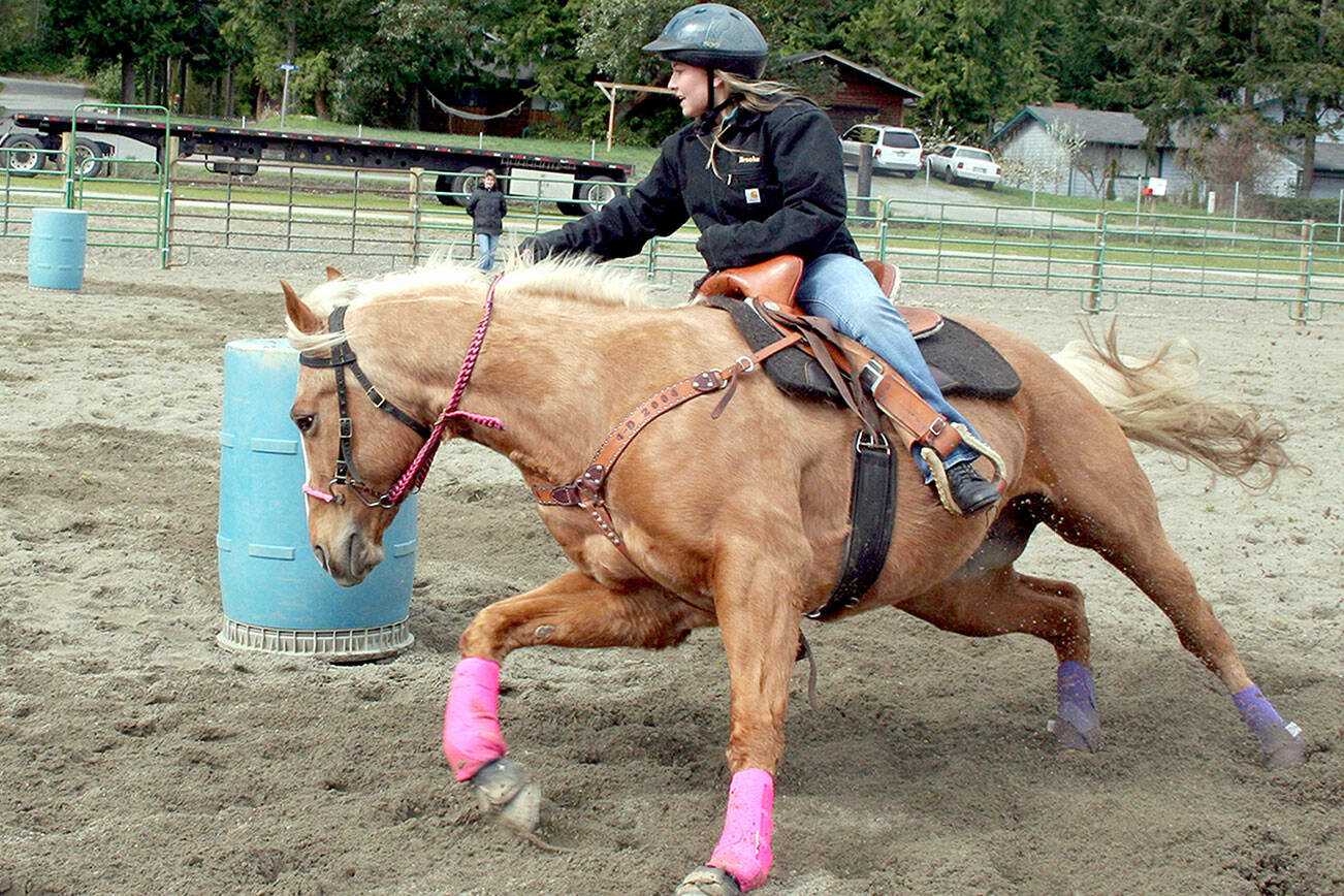 Photo by Karen Griffiths

Cutline: My niece Brooke Stromberg and Lacy, both 15, make a winning turn during a barrel racing competition during an April game show in 2008  at JeffCo fairgrounds.   Later, the duo became the 2008 Washington High School Equestrian Team  and Patterned Speed Horse Association’s (junior division) state champions in barrel racing. Both shows were held in Wenatchee.