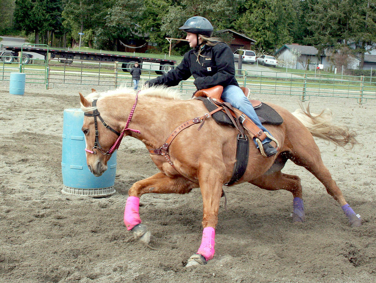 Brooke Stromberg and Lacey, both 15, make a winning turn during a barrel racing competition during an April game show in 2008 at the Jefferson County fairgrounds. Later, the duo became the 2008 Washington High School Equestrian Team and Patterned Speed Horse Association’s (junior division) state champions in barrel racing. Both shows were held in Wenatchee. (Karen Griffiths/For Peninsula Daily News)