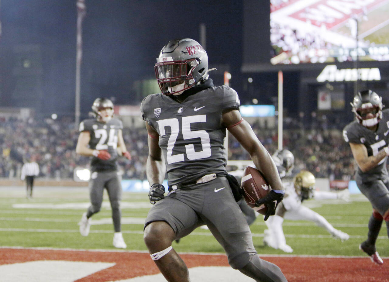 Washington State running back Nakia Watson (25) celebrates his touchdown during the first half of an NCAA college football game against Colorado on Friday in Pullman, Wash. (Young Kwak/The Associated Press)