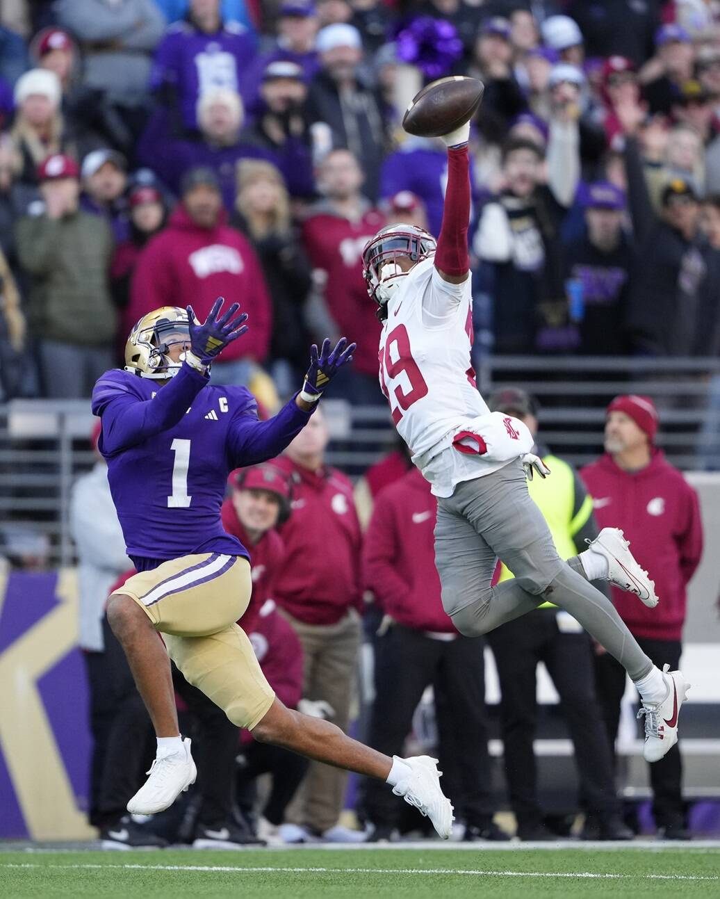 Washington State defensive back Jamorri Colson swats away a pass meant for Washington wide receiver Rome Odunze during the first half of an NCAA college football game, Saturday in Seattle. (AP Photo/Lindsey Wasson)