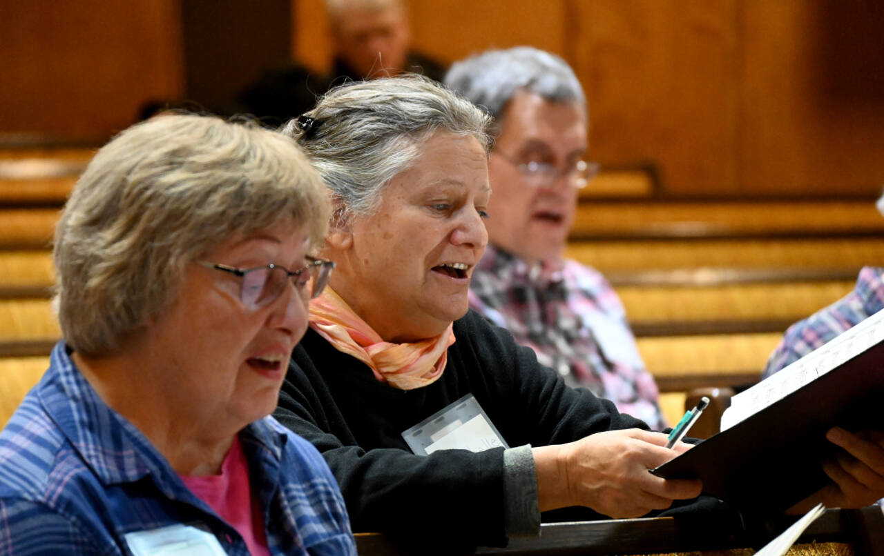 Singers rehearse at Sequim Seventh-day Adventist Church in mid-November for upcoming Sequim Community Christmas Chorus performances. (Michael Dashiell / Olympic Peninsula News Group)